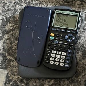 Texas Instruments TI-83 Plus Graphing Calculator - Blue and Black